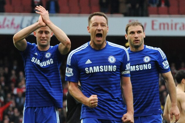 Chelsea's captain John Terry, center, celebrates after the final whistle after the English Premier League soccer match between Arsenal and Chelsea at the Emirates Stadium, London, England, Sunday, April 26, 2015. (AP Photo/Rui Vieira)