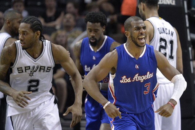 Los Angeles Clippers' Chris Paul (3) celebrates after scoring against the San Antonio Spurs during the second half of Game 4 in an NBA basketball first-round playoff series, Sunday, April 26, 2015, in San Antonio. (AP Photo/Darren Abate)