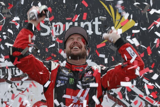 Kurt Busch celebrates after winning the NASCAR Sprint Cup auto race at Richmond International Raceway in Richmond, Va., Sunday, April 26, 2015. (AP Photo/Steve Helber)