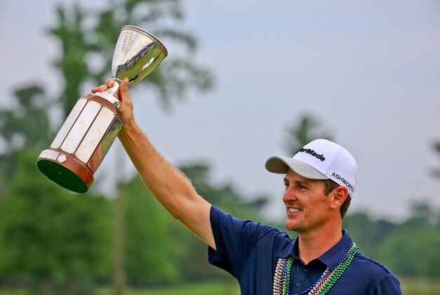 Apr 26, 2015; Avondale, LA, USA; Justin Rose holds up the Zurich Classic championship trophy following his win in the final round of the Zurich Classic at TPC Louisiana. Mandatory Credit: Derick E. Hingle-USA TODAY Sports