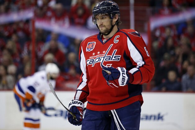 Washington Capitals left wing Alex Ovechkin (8), from Russia, pauses on the ice during the first period of Game 5 in the first round of the NHL hockey Stanley Cup playoffs against the New York Islanders, Thursday, April 23, 2015, in Washington. (AP Photo/Alex Brandon)