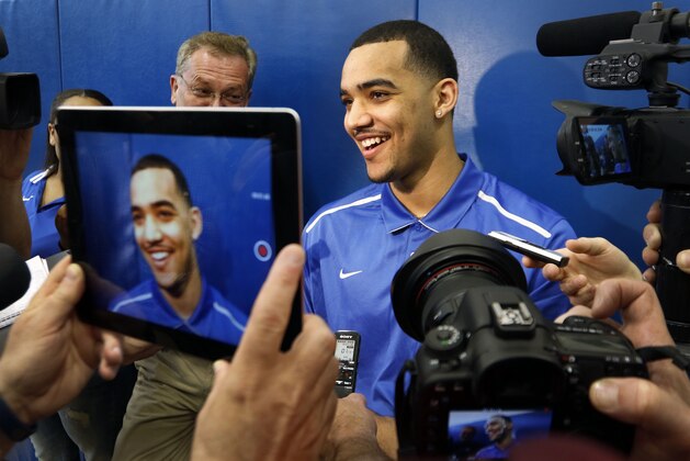 Kentucky NCAA college basketball player Trey Lyles speaks to reporters after announcing his intent to place his name in the NBA draft during a news conference at the Joe Craft Center, Thursday, April 9, 2015, in Lexington, Ky. (AP Photo/James Crisp)