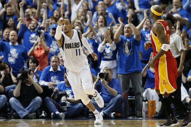 Dallas Mavericks' Monta Ellis (11) celebrates a score against the Houston Rockets during the first half of Game 3 in an NBA basketball first-round playoff series Friday, April 24, 2015, in Dallas. (AP Photo/Tony Gutierrez)