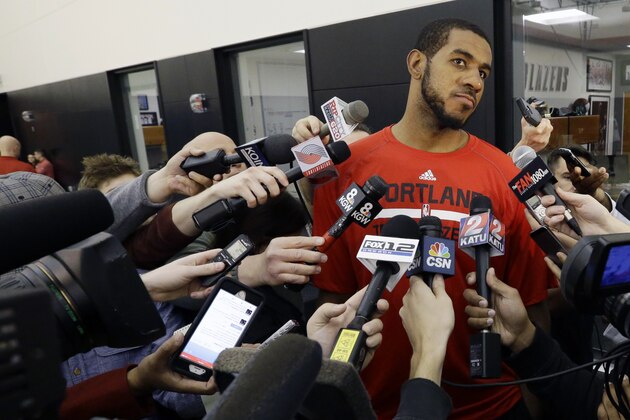 Portland Trail Blazers forward LaMarcus Aldridge talks after NBA basketball practice in Portland, Ore., Friday, April 24, 2015. The Memphis Grizzlies lead the Trail Blazers 2-0 in the first-round series heading into Saturday's Game 3 in Portland. (AP Photo/Don Ryan)