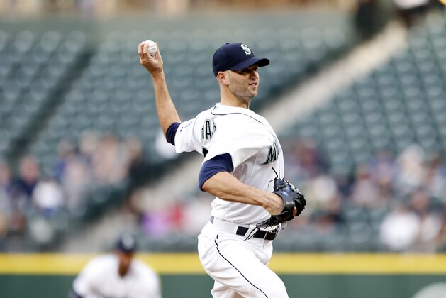 Seattle Mariners pitcher J.A. Happ throws out a pitch in the first inning against the Houston Astros in a baseball game Wednesday, April 22, 2015, in Seattle. (AP Photo/Jennifer Buchanan)