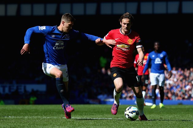 LIVERPOOL, ENGLAND - APRIL 26:  Daley Blind of Manchester United in action with John Stones of Everton during the Barclays Premier League match between Everton and Manchester United at Goodison Park on April 26, 2015 in Liverpool, England.  (Photo by Clive Brunskill/Getty Images)