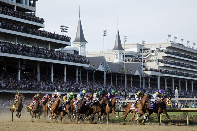 Horses make their way around turn one during the 140th running of the Kentucky Derby horse race at Churchill Downs Saturday, May 3, 2014, in Louisville, Ky. (AP Photo/Darron Cummings)