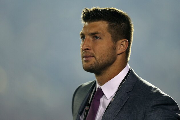 PASADENA, CA - JANUARY 06:  ESPN analyst Tim Tebow looks on during the 2014 Vizio BCS National Championship Game between the Florida State Seminoles and the Auburn Tigers at the Rose Bowl on January 6, 2014 in Pasadena, California.  (Photo by Jeff Gross/Getty Images)