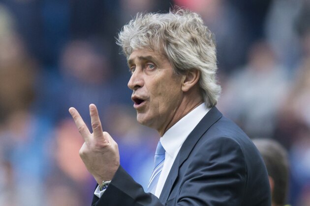 Manchester City's manager Manuel Pellegrini gestures as his team beats West Ham United 2-0 during the English Premier League soccer match between Manchester City and West Ham United at the Etihad Stadium, Manchester, England, Sunday April 19, 2015. (AP Photo/Jon Super)