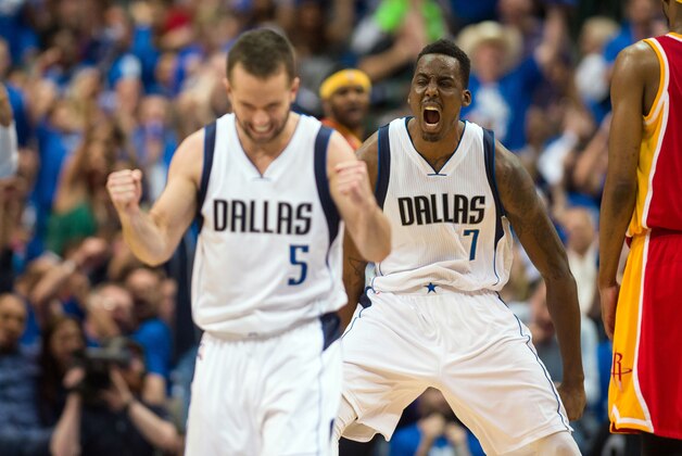 Apr 26, 2015; Dallas, TX, USA; Dallas Mavericks forward Al-Farouq Aminu (7) and guard J.J. Barea (5) celebrate a basket against the Houston Rockets during the second half in game four of the first round of the NBA Playoffs. at American Airlines Center. The Mavericks defeated the Rockets 121-109. Mandatory Credit: Jerome Miron-USA TODAY Sports