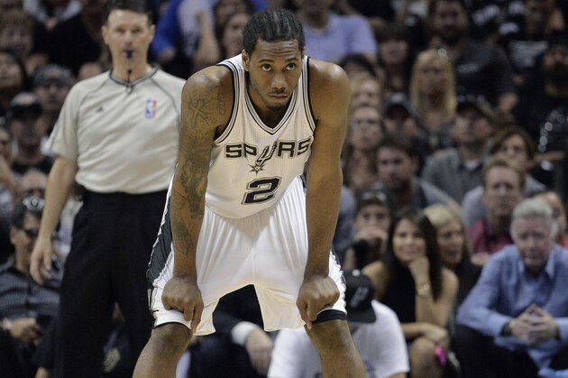 San Antonio Spurs forward Kawhi Leonard stands on the court during the second half of Game 4 in an NBA basketball first-round playoff series against the Los Angeles Clippers, Sunday, April 26, 2015, in San Antonio. Los Angeles won 114-105. (AP Photo/Darren Abate)