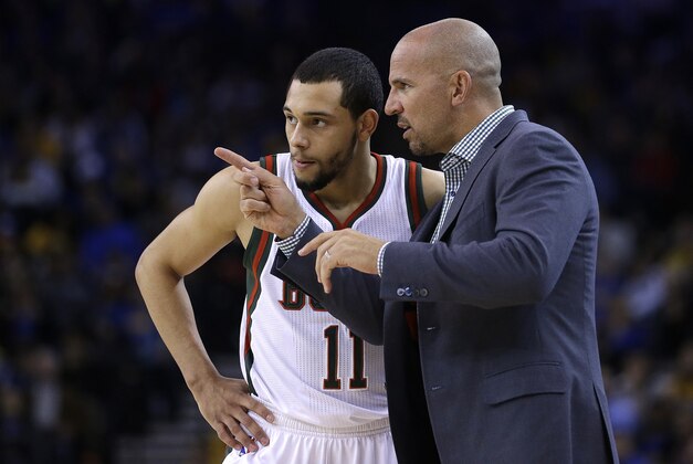 Milwaukee Bucks coach Jason Kidd speaks with Tyler Ennis during the first half of an NBA basketball game against the Golden State Warriors on Wednesday, March 4, 2015, in Oakland, Calif. (AP Photo/Ben Margot)