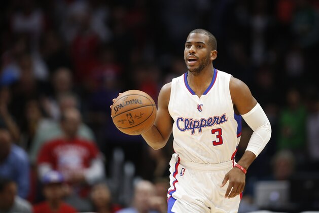 Los Angeles Clippers' Chris Paul dribbles the ball against the Denver Nuggets during the first half of an NBA basketball game, Monday, April 13, 2015, in Los Angeles. (AP Photo/Danny Moloshok)