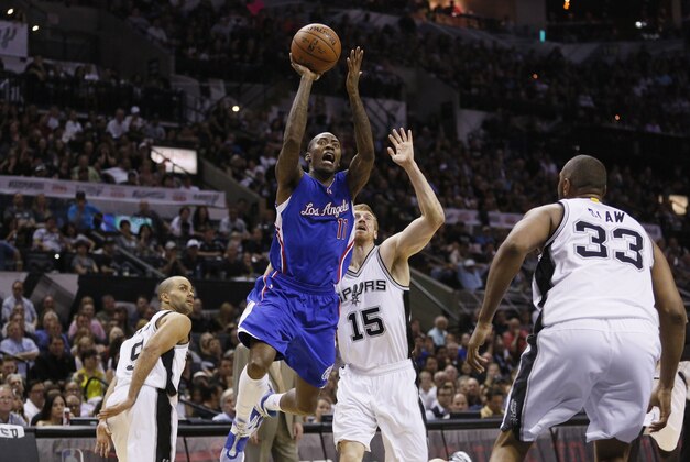 Apr 26, 2015; San Antonio, TX, USA; Los Angeles Clippers shooting guard Jamal Crawford (11) shoots the ball past San Antonio Spurs power forward Matt Bonner (15) in game four of the first round of the NBA Playoffs at AT&T Center. Mandatory Credit: Soobum Im-USA TODAY Sports