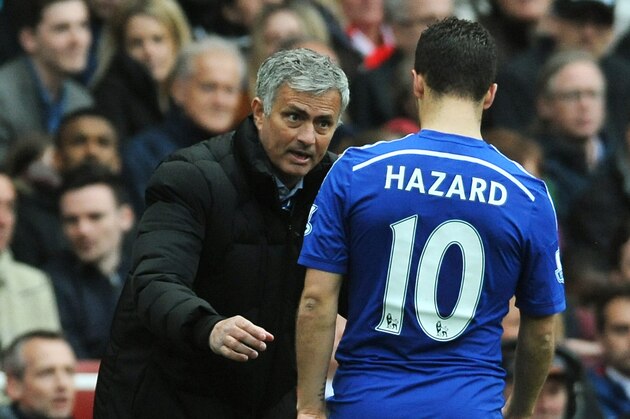 Chelsea manager Jose Mourinho speaks to his player Eden Hazard during the English Premier League soccer match between Arsenal and Chelsea at the Emirates Stadium, London, England, Sunday, April 26, 2015. (AP Photo/Rui Vieira)