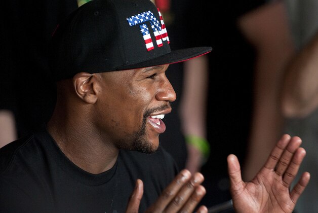 Apr 14, 2015; Las Vegas, NV, USA; Floyd Mayweather Jr., answers questions from reporters before training at Mayweather Boxing Club. Mandatory Credit: Stephen R. Sylvanie-USA TODAY Sports