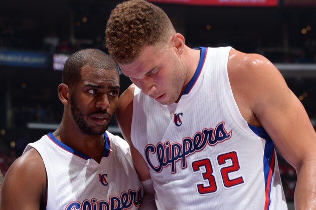 LOS ANGELES, CA - APRIL 19: Chris Paul #3 and Blake Griffin #32 of the Los Angeles Clippers speak during a game against the San Antonio Spurs in Game One of the Western Conference Quarterfinals during the 2015 NBA Playoffs on April 19, 2015 at Staples Center in Los Angeles, California. NOTE TO USER: User expressly acknowledges and agrees that, by downloading and or using this Photograph, user is consenting to the terms and conditions of the Getty Images License Agreement. Mandatory Copyright Notice: Copyright 2015 NBAE (Photo by Andrew D. Bernstein/NBAE via Getty Images)