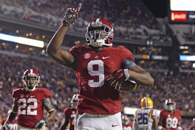 Alabama wide receiver Amari Cooper (9) celebrates his 23 yard touchdown reception in the first half of an NCAA college football game against LSU in Baton Rouge, La., Saturday, Nov. 8, 2014. (AP Photo/Jonathan Bachman)
