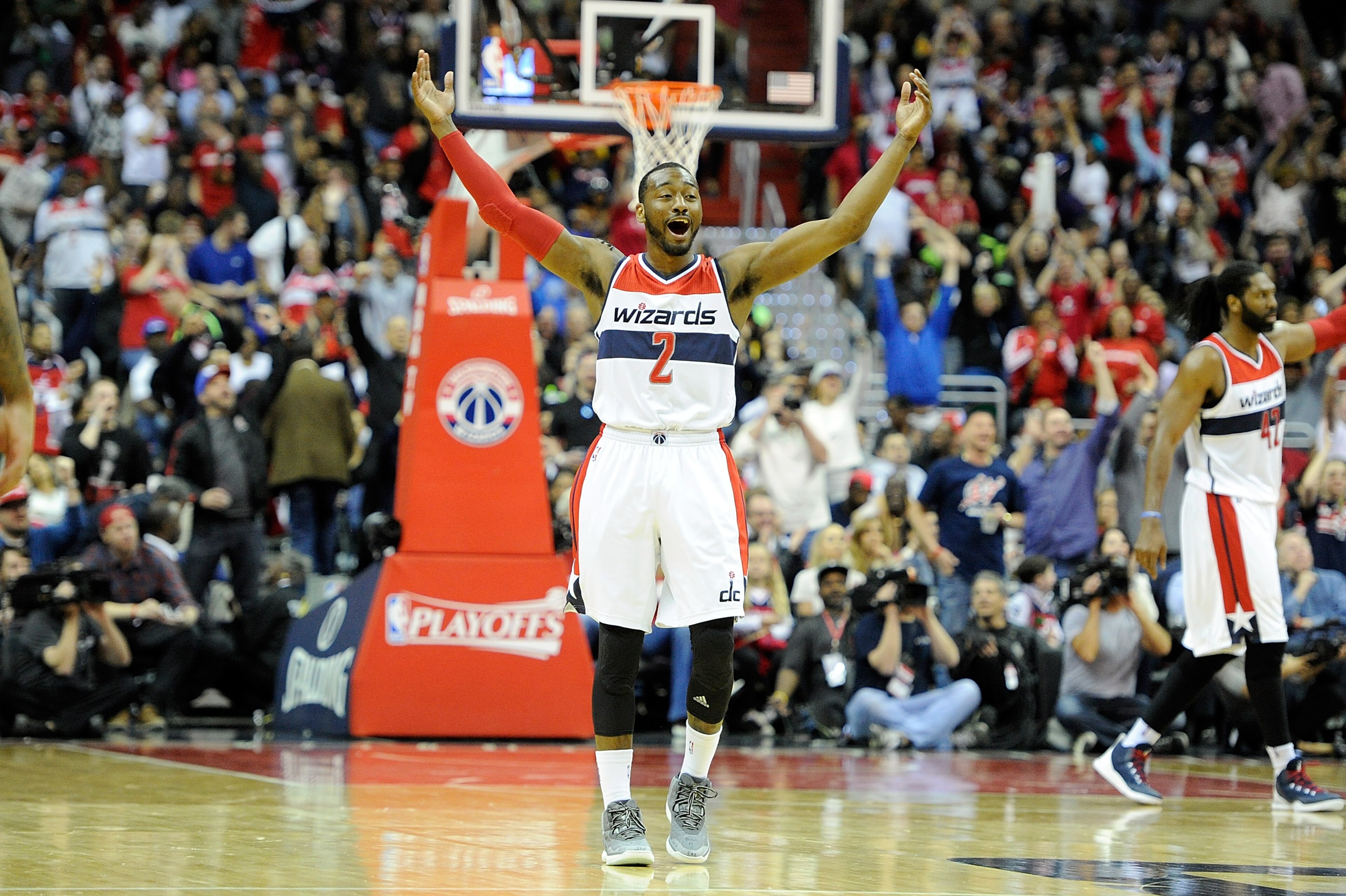 WASHINGTON, DC - APRIL 26: John Wall #2 of the Washington Wizards celebrates during the third quarter of the game against the Toronto Raptors during Game Four of the Eastern Conference Quarterfinals of the NBA playoffs at Verizon Center on April 26, 2015 in Washington, DC. Washington won the game 125-94. NOTE TO USER: User expressly acknowledges and agrees that, by downloading to the terms and conditions of the Getty Images License Agreement. (Photo by Greg Fiume/Getty Images)