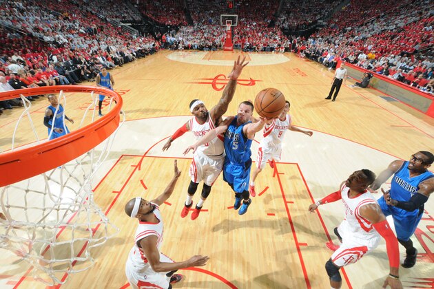 HOUSTON, TX - APRIL 21: J.J. Barea #5 of the Dallas Mavericks goes for the layup against the Houston Rockets during Game Two of the Western Conference Quarterfinals of the 2015 NBA Playoffs on April 21, 2015 at the Toyota Center in Houston, Texas. NOTE TO USER: User expressly acknowledges and agrees that, by downloading and or using this photograph, User is consenting to the terms and conditions of the Getty Images License Agreement. Mandatory Copyright Notice: Copyright 2015 NBAE (Photo by Bill Baptist/NBAE via Getty Images)