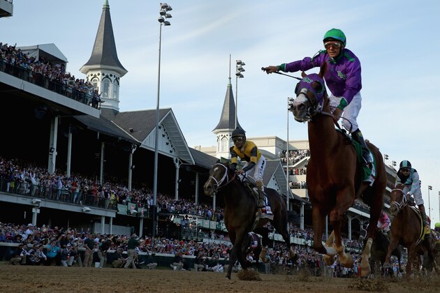 LOUISVILLE, KY - MAY 03:  Jockey Victor Espinoza celebrates atop of California Chrome #5 after crossing the finish line to win the 140th running of the Kentucky Derby at Churchill Downs on May 3, 2014 in Louisville, Kentucky.  (Photo by Rob Carr/Getty Images)