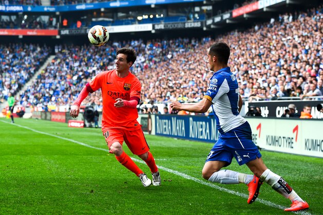 BARCELONA, SPAIN - APRIL 25:  Lionel Messi of FC Barcelona competes for the ball with Lucas Vazquez of RCD Espanyol during the La Liga match between RCD Espanyol and FC Barcelona at Cornella-El Prat Stadium on April 25, 2015 in Barcelona, Spain.  (Photo by David Ramos/Getty Images)
