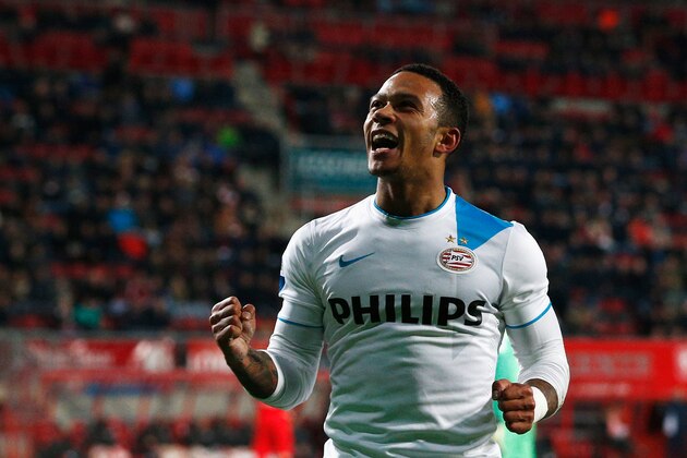 ENSCHEDE, NETHERLANDS - APRIL 04:  Memphis Depay of PSV celebrates after he scores the fifth goal of the game for his team during the Dutch Eredivisie match between FC Twente and PSV Eindhoven held at De Grolsch Veste Stadium on April 4, 2015 in Enschede, Netherlands.  (Photo by Dean Mouhtaropoulos/Getty Images)