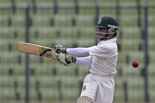 Bangladesh's batsman Mominul Haque plays a shot during the second day of the first cricket test match against Zimbabwe in Dhaka, Bangladesh, Sunday, Oct. 26, 2014. (AP Photo/A.M. Ahad)