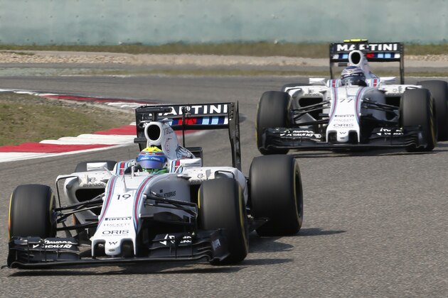 Williams drivers Felipe Massa of Brazil is followed by teammate Valtteri Bottas of Finland during the Chinese Formula One Grand Prix at Shanghai International Circuit in Shanghai, China, Sunday, April 12, 2015. Mssa finished fifth as Bottas was sixth. (AP Photo/Toru Takahashi)
