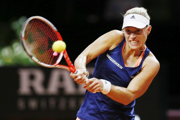 Germany's Angelique Kerber hits a backhand against USA's Madison Brengle in a semi-final tennis match at the WTA tournament in Stuttgart, Germany, Saturday, April 25, 2015. (AP Photo/Michael Probst)