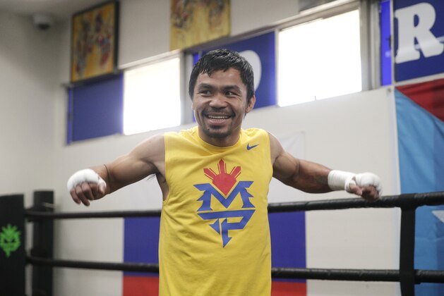 Boxer Manny Pacquiao, of the Philippines, smiles during a workout at Wild Card Boxing Club, Monday, April 27, 2015, in Los Angeles. Pacquiao is scheduled to fight Floyd Mayweather Jr. in a welterweight boxing match in Las Vegas Saturday. (AP Photo/Jae C. Hong)
