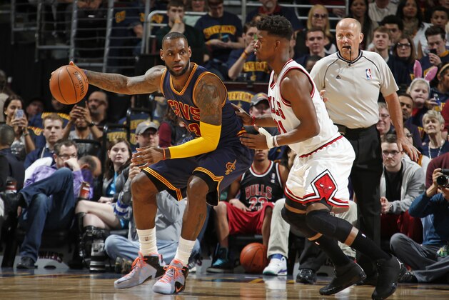 CLEVELAND, OH - APRIL 5:  LeBron James #23 of the Cleveland Cavaliers handles the ball against Jimmy Butler #21 of the Chicago Bulls on April 5, 2015 at Quicken Loans Arena in Cleveland, Ohio. NOTE TO USER: User expressly acknowledges and agrees that, by downloading and/or using this Photograph, user is consenting to the terms and conditions of the Getty Images License Agreement. Mandatory Copyright Notice: Copyright 2015 NBAE (Photo by Gregory Shamus/NBAE via Getty Images)
