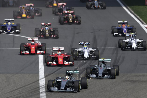 Mercedes driver Lewis Hamilton (44) of Britain leads the field at the start of the Chinese Formula One Grand Prix at Shanghai International Circuit in Shanghai, China, Sunday, April 12, 2015. (AP Photo/Andy Wong)