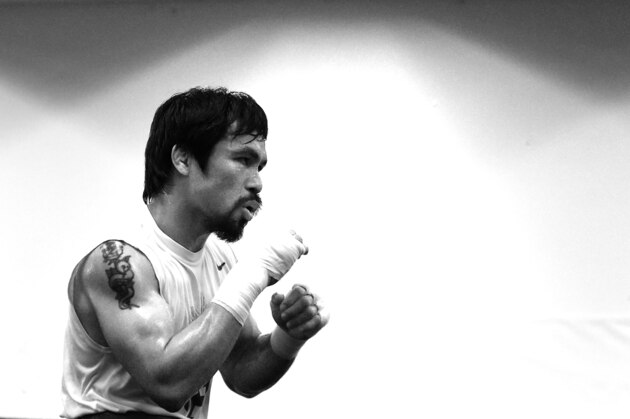 LOS ANGELES, CA - APRIL 13:  (EDITOR'S NOTE: Image has been converted to black and white.)Manny Pacquiao trains in prepation for his fight against Floyd Mayweather Jr. at the Wild Card Boxing Club on April 13, 2015 in Los Angeles, California.  (Photo by Harry How/Getty Images)