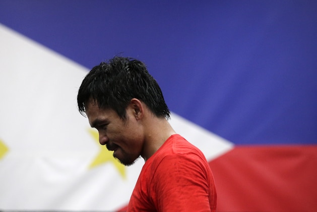 Boxer Manny Pacquiao, of the Philippines, stands on the canvas during his workout at Wild Card Boxing Club, Monday, April 27, 2015, in Los Angeles. Pacquiao is scheduled to fight Floyd Mayweather Jr. in a welterweight boxing match in Las Vegas Saturday. (AP Photo/Jae C. Hong)