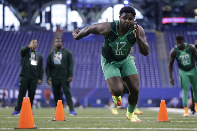 Florida State defensive lineman Mario Edwards runs a drill at the NFL football scouting combine in Indianapolis, Sunday, Feb. 22, 2015. (AP Photo/Julio Cortez)