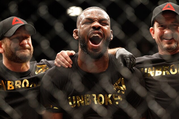 LAS VEGAS, NV - JANUARY 03:  Jon Jones (C) yells out after defeating Daniel Comier in a light heavyweight title fight at the MGM GrandGarden Arena on January 3, 2015 in Las Vegas, Nevada. Jones retained his title by unanimous decision.  (Photo by Steve Marcus/Getty Images)