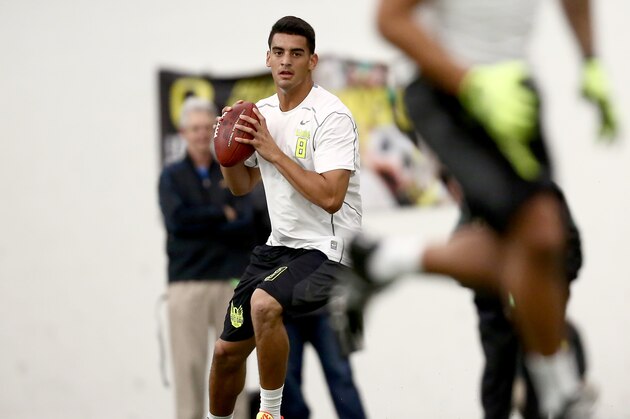 Oregon's Marcus Mariota works out for NFL football scouts during Pro Day at the University of Oregon, Thursday, March 12, 2015, in Eugene, Ore. (AP Photo/Ryan Kang)