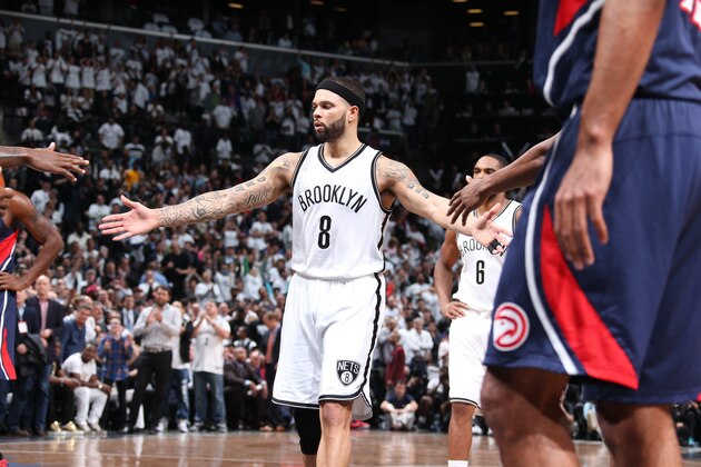 BROOKLYN, NY - APRIL 27: Deron Williams #8 of the Brooklyn Nets high fives teammates during Game Four of the Eastern Conference Quarterfinals against the Atlanta Hawks during the NBA Playoffs on April 27, 2015 at Barclays Center in Brooklyn, NY. NOTE TO USER: User expressly acknowledges and agrees that, by downloading and/or using this Photograph, user is consenting to the terms and conditions of the Getty Images License Agreement. Mandatory Copyright Notice: Copyright 2015 NBAE (Photo by Nathaniel S. Butler/NBAE via Getty Images)