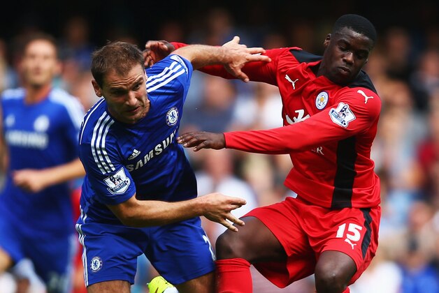 LONDON, ENGLAND - AUGUST 23:  Jeffrey Schlupp of Leicester City holds off Branislav Ivanovic of Chelsea during the Barclays Premier League match between Chelsea and Leicester City at Stamford Bridge on August 23, 2014 in London, England.  (Photo by Paul Gilham/Getty Images)