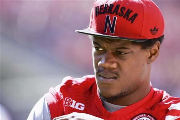 FILE - In a Sept. 6, 2014, file photo then-Nebraska defensive end Randy Gregory wears street clothes before an NCAA college football game against McNeese State in Lincoln, Neb. Randy Gregory says he's tested positive for marijuana at the NFL scouting combine last month and that he failed two drug tests at Nebraska last year. Gregory disclosed his marijuana use in an interview with NFL Media on Wednesday, March 25, 2015.  Gregory went into February's scouting combine projected to be among the top 10 picks  (AP Photo/Nati Harnik, File)
