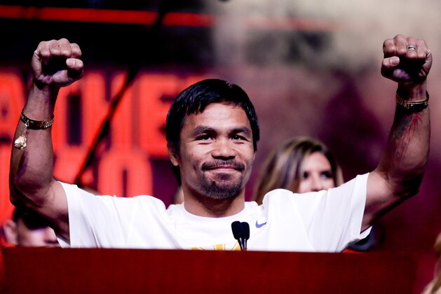 Boxer Manny Pacquiao, of the Philippines, greets fans at a rally in Las Vegas, Tuesday, April 28, 2015. Floyd Mayweather Jr. and Manny Pacquiao are scheduled to fight May 2. (AP Photo/Chris Carlson)