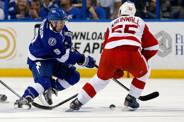 TAMPA, FL - APRIL 18: Tyler Johnson #9 of the Tampa Bay Lightning attempts to get past Niklas Kronwall #55 of the Detroit Red Wings in Game Two of the Eastern Conference Quarterfinals during the 2015 NHL Stanley Cup Playoffs at Amalie Arena on April 18, 2015 in Tampa, Florida. (Photo by Mike Carlson/Getty Images)