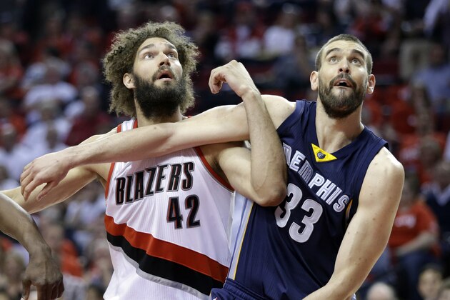Marc Gasol, right, battles for rebound position with Portland Trail Blazers center Robin Lopez during the second half of Game 4 of a first-round NBA basketball playoff series in Portland, Ore., Monday, April 27, 2015.  (AP Photo/Don Ryan)