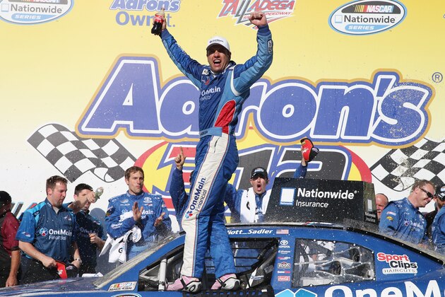 TALLADEGA, AL - MAY 03: Elliott Sadler, driver of the #11 OneMain Financial Toyota, celebrates in Victory Lane after winning the NASCAR Nationwide Series Aaron's 312 at Talladega Superspeedway on May 3, 2014 in Talladega, Alabama.  (Photo by Sean Gardner/Getty Images)