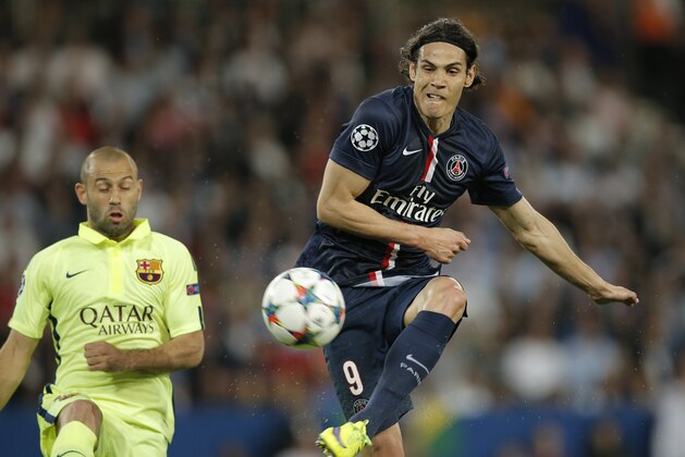PSG's Edinson Cavani, right, shoots in front of Barcelona's Javier Mascherano during the quarterfinal first leg Champions League soccer match between Paris Saint Germain and Barcelona at the Parc des Princes stadium in Paris, France, Wednesday, April 15, 2015. (AP Photo/Christophe Ena)