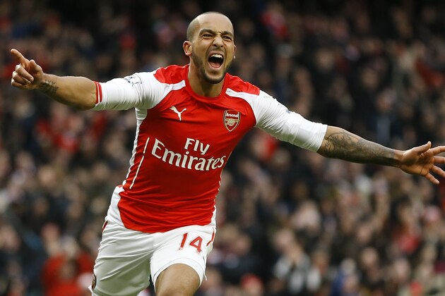Arsenal's Theo Walcott celebrates scoring a goal during the English Premier League soccer match between Arsenal and Aston Villa at the Emirates stadium in London, Sunday, Feb. 1, 2015. (AP Photo/Kirsty Wigglesworth)