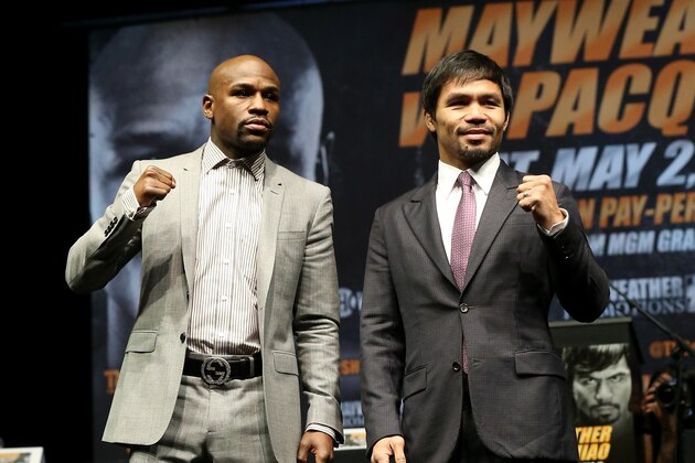LOS ANGELES, CA - MARCH 11:  Floyd Mayweather (L) and Manny Pacquiao pose together at the end of their Press Conference promoting their upcoming fight on March 11, 2015 in Los Angeles, California.  (Photo by Stephen Dunn/Getty Images)