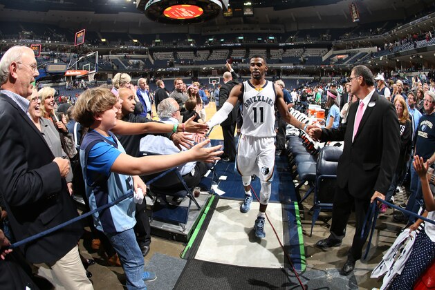 MEMPHIS, TN - OCTOBER 29: Mike Conley #11 of the Memphis Grizzlies greets fans after the game against the Minnesota Timberwolves on October 29, 2014 at FedExForum in Memphis, Tennessee. NOTE TO USER: User expressly acknowledges and agrees that, by downloading and or using this photograph, User is consenting to the terms and conditions of the Getty Images License Agreement. Mandatory Copyright Notice: Copyright 2014 NBAE (Photo by Joe Murphy/NBAE via Getty Images)
