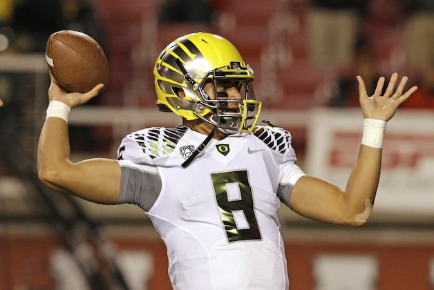 Oregon quarterback Marcus Mariota (8) warms up before an NCAA college football game against Utah on Saturday, Nov. 8, 2014, in Salt Lake City. (AP Photo/Rick Bowmer)